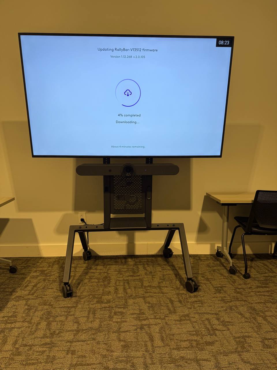75-inch commercial display and Logitech Rally video conferencing system on a mobile AV cart
